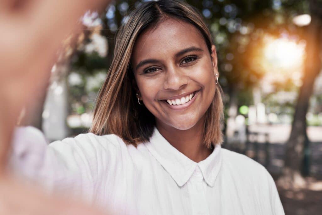 Woman smiling with natural-looking, balanced teeth