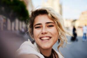 Woman smiling with naturally uneven teeth